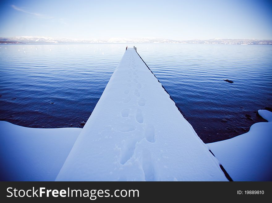 A snow covered pier in Lake Tahoe
