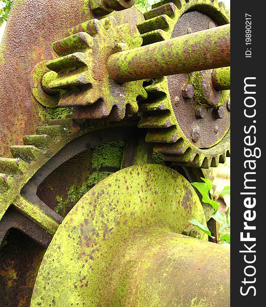 Old moss covered machinery closeup. Old moss covered machinery closeup