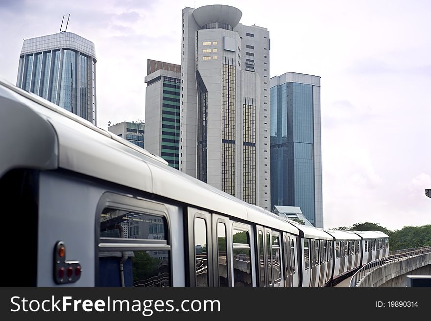 Cityscape with metro and high office buildings in Kuala Lumpur, Malaysia