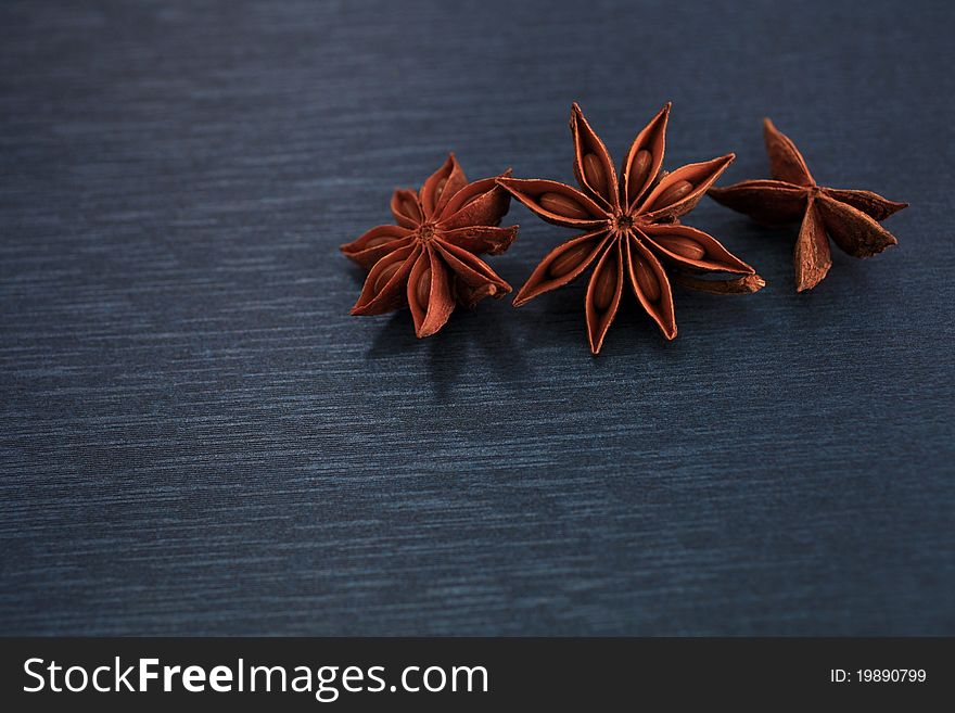 Star anise on a blue background