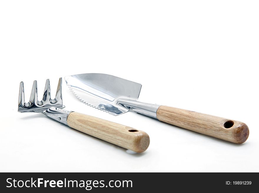 Gardening fork shovel trowel lute isolated on white background