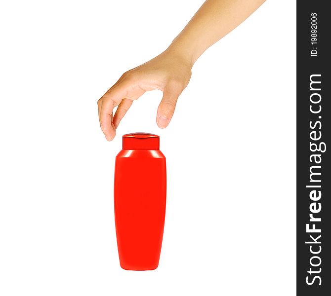 Hand with plastic bottle isolated on a white background