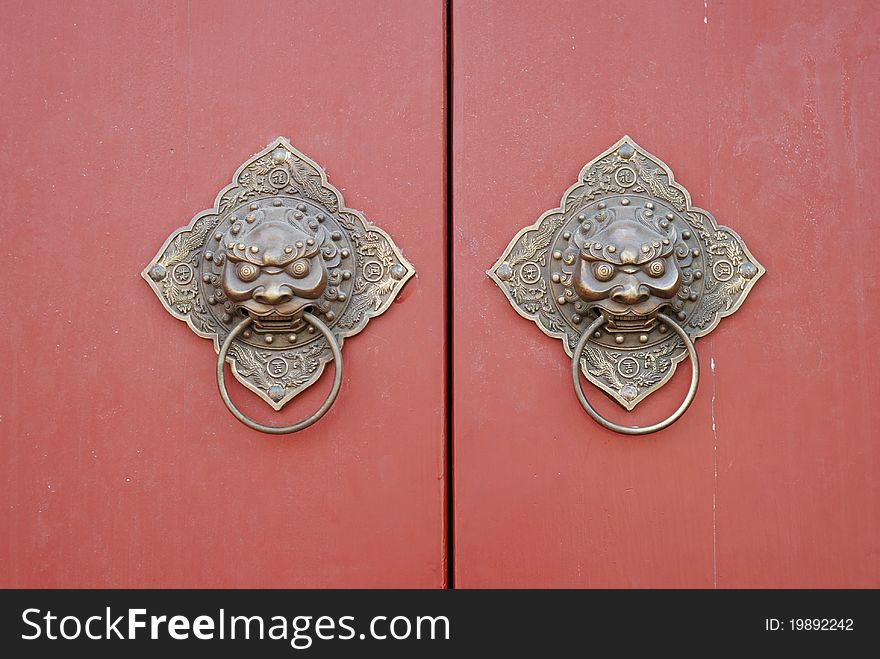 The lion doorknob in China. The traditional symbol of China. The lion doorknob in China. The traditional symbol of China.