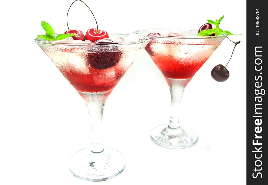Alcohol red liqueur cocktail with ice and cherry. Alcohol red liqueur cocktail with ice and cherry