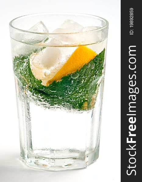 Fabulous cold water with ice lemon and mint in a glass. Fabulous cold water with ice lemon and mint in a glass