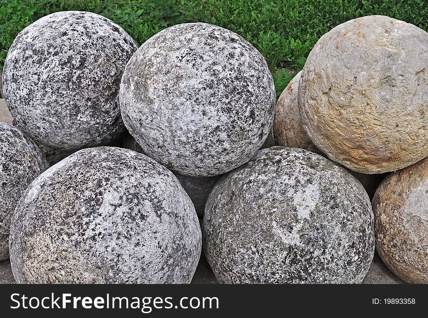 Collection of old stone cannon balls in ancient russian Goritsky monastery of Pereslavl-Zalessky. Collection of old stone cannon balls in ancient russian Goritsky monastery of Pereslavl-Zalessky
