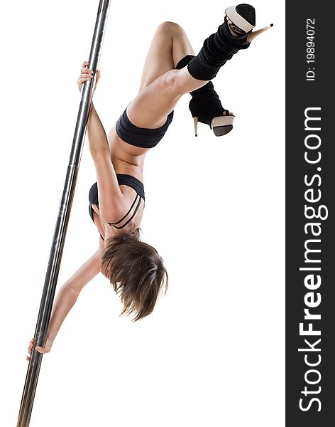 Young sexy woman exercise pole dance against a white background. Young sexy woman exercise pole dance against a white background