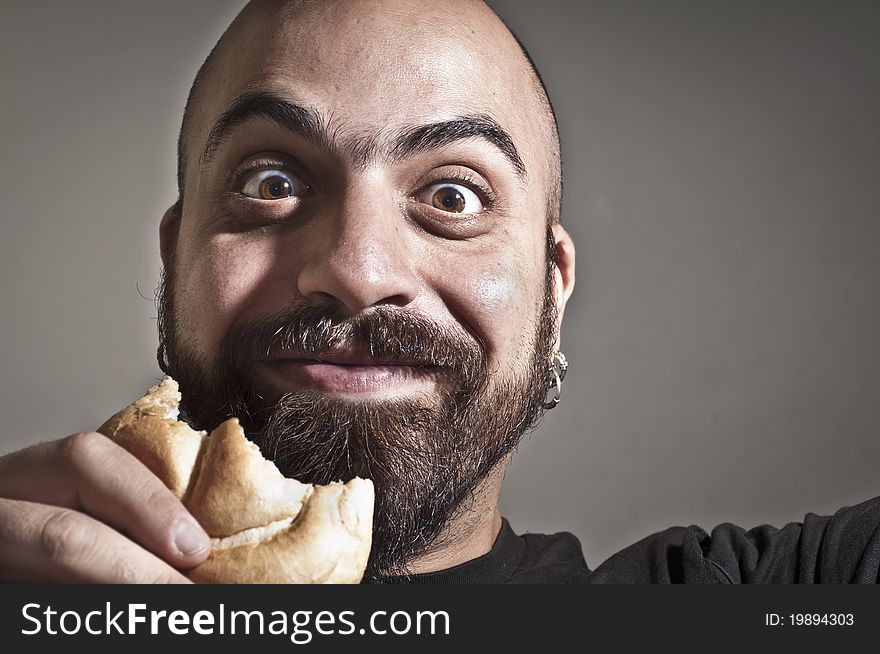 Happy Man With Bread In His Mouth