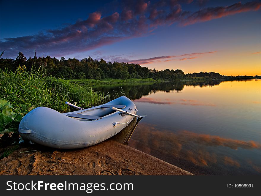 Sunset scene photographed with a boat in the frame. Sunset scene photographed with a boat in the frame