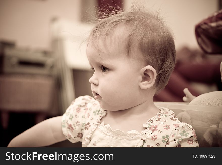 Little baby girl playing in nursery room. Little baby girl playing in nursery room