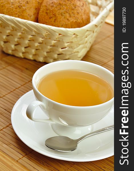 Cup of tea and a basket of bread for breakfast