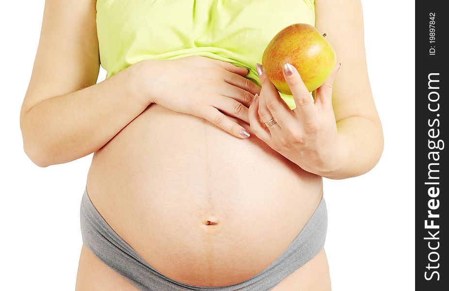 The pregnant married woman holds the apple