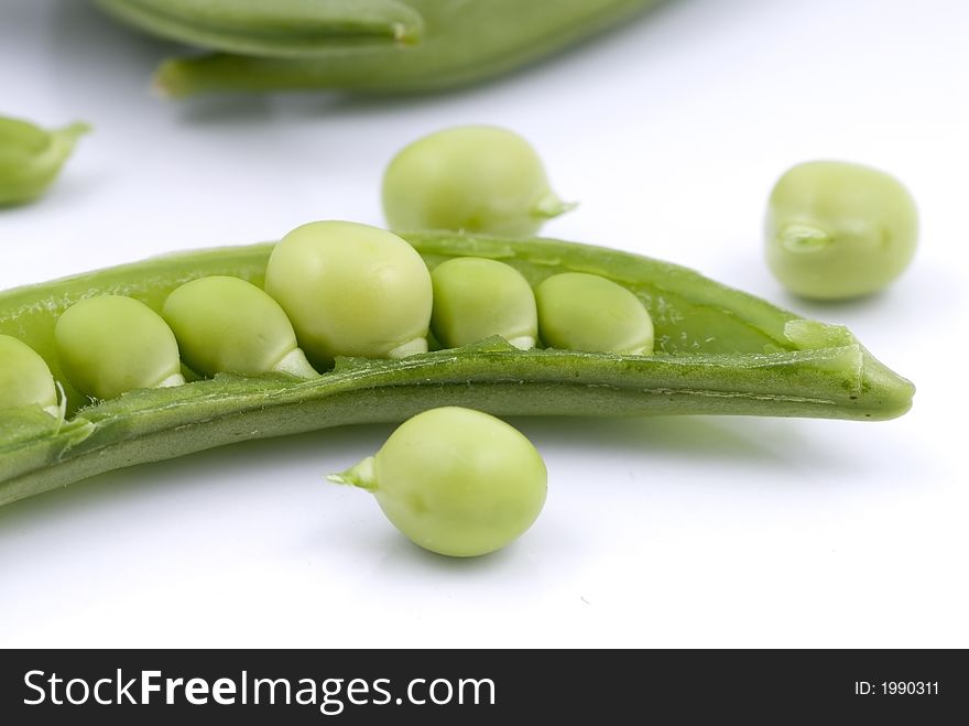 Cut green sweet peas with seeds