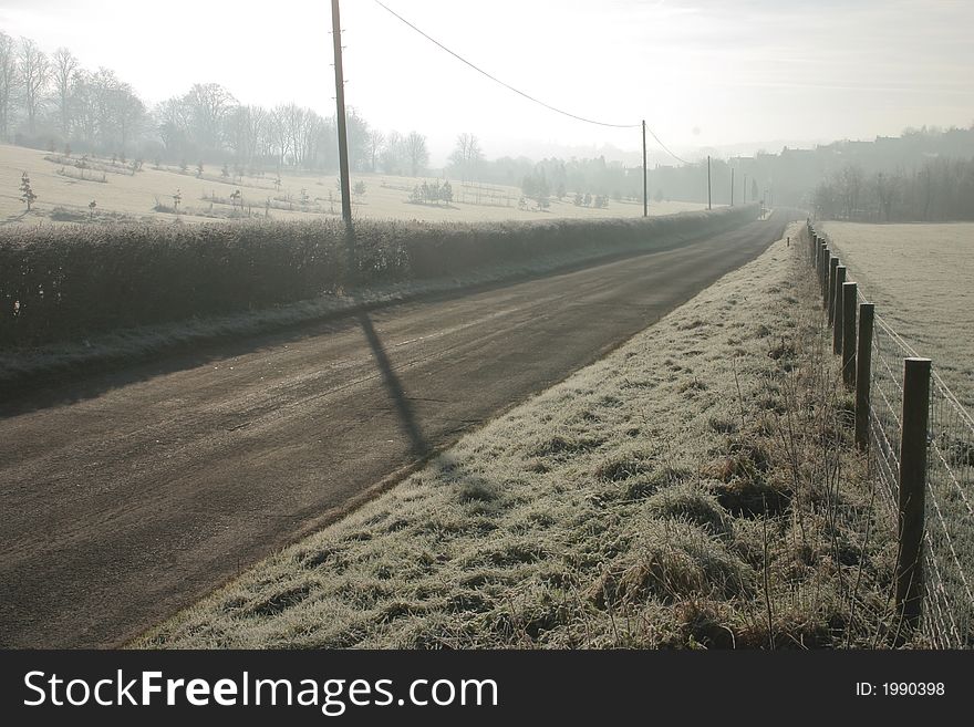 Lonely rural road early on a winters morning of freezing mist. Lonely rural road early on a winters morning of freezing mist