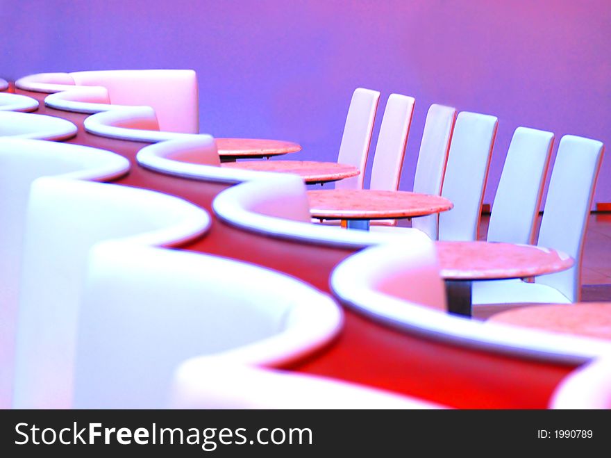 A couch and tables in a cafe. A couch and tables in a cafe