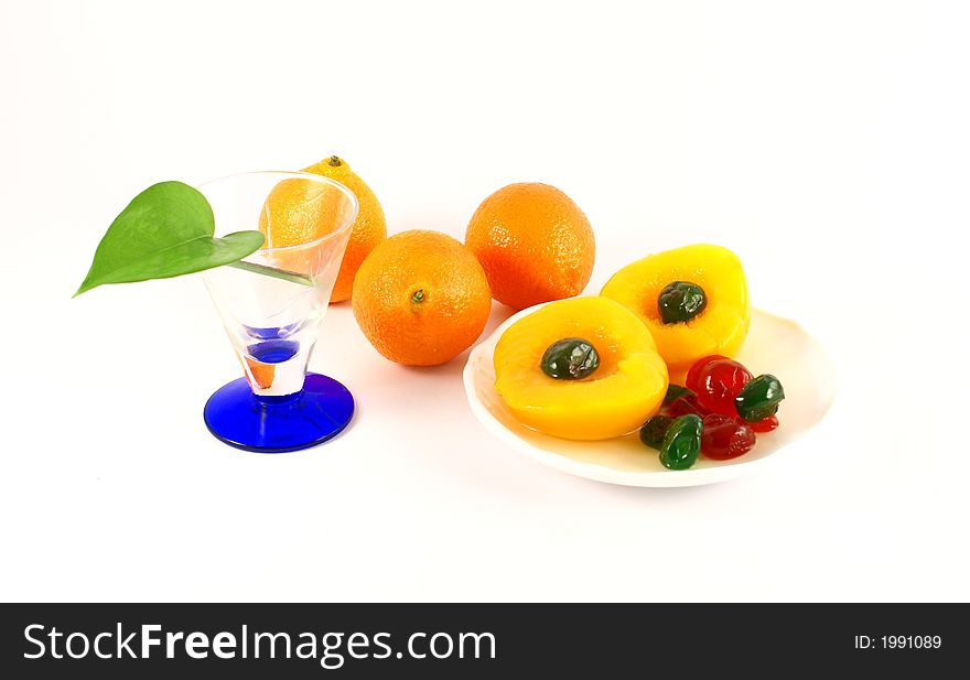 Isolated photo of fruits selections peach orange and glaced cherries. Isolated photo of fruits selections peach orange and glaced cherries