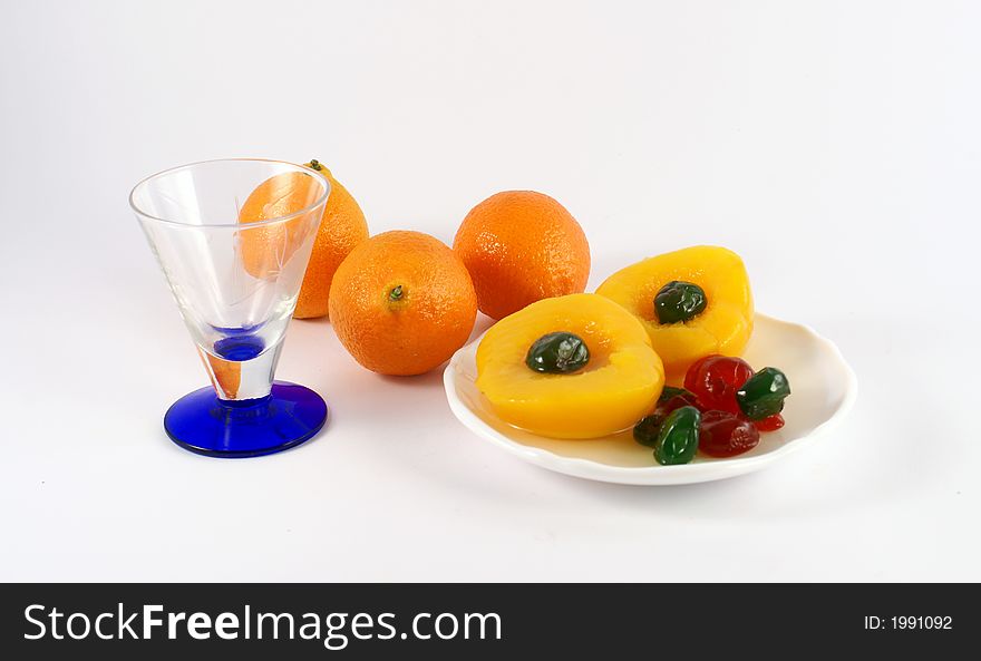 Isolated photo of fruits selections peach orange and glaced cherries. Isolated photo of fruits selections peach orange and glaced cherries