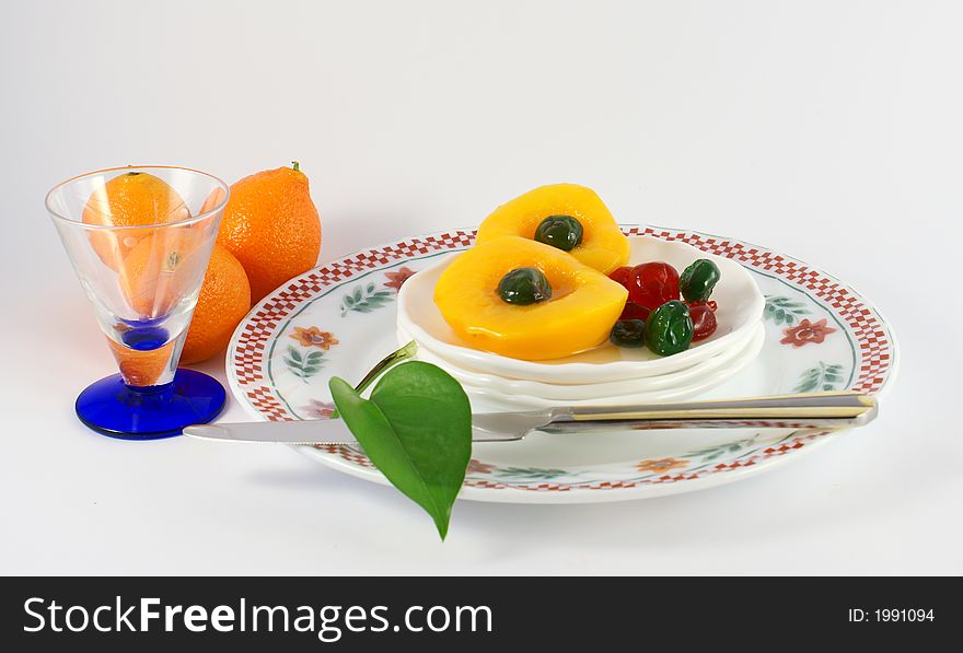 Isolated photo of fruits selections peach orange and glaced cherries. Isolated photo of fruits selections peach orange and glaced cherries