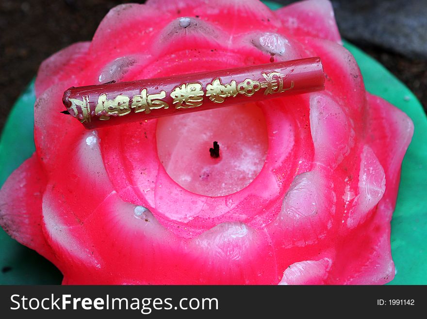 Pink candle at a temple during Chinese New Year celebrations in Qingdao, China.