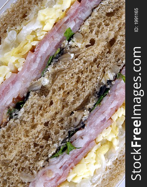Close-up sandwich
with ham and vegetables. Close-up sandwich
with ham and vegetables