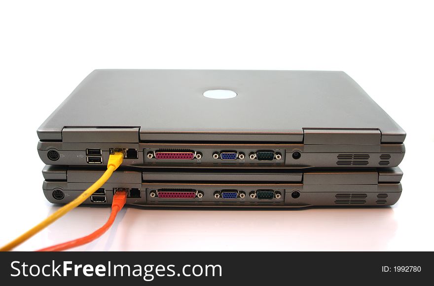 2 Laptops with network Cables on a white background
