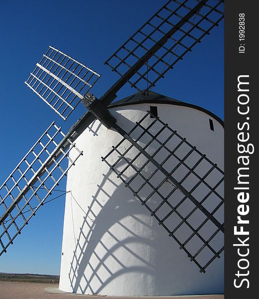 White mill in a sunny day with a blue sky. White mill in a sunny day with a blue sky