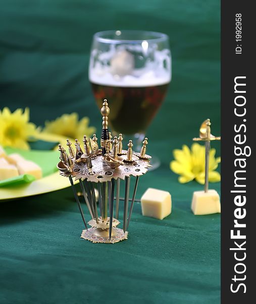 Decorative rapiers with cheese and beer. Decorative rapiers with cheese and beer