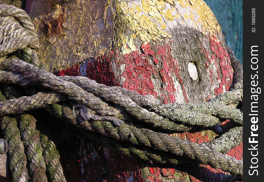 Close up shot of a worn lobster pot and rope at Motiff #1 in Rockport, MA. Close up shot of a worn lobster pot and rope at Motiff #1 in Rockport, MA