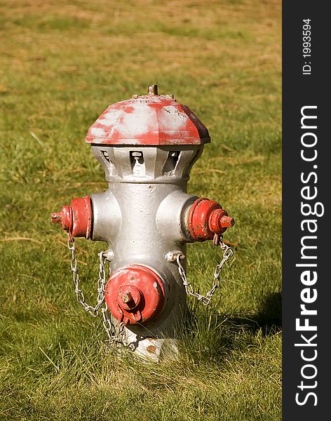 Old fire hydrant in a grassy field