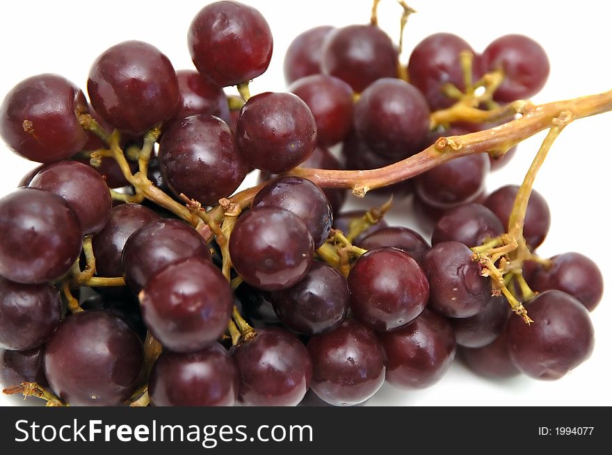 A bunch of grapes isolated against a white background