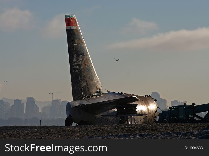 Wreckage of commercial airliner on beach withVancouver in distance (film set). Wreckage of commercial airliner on beach withVancouver in distance (film set)