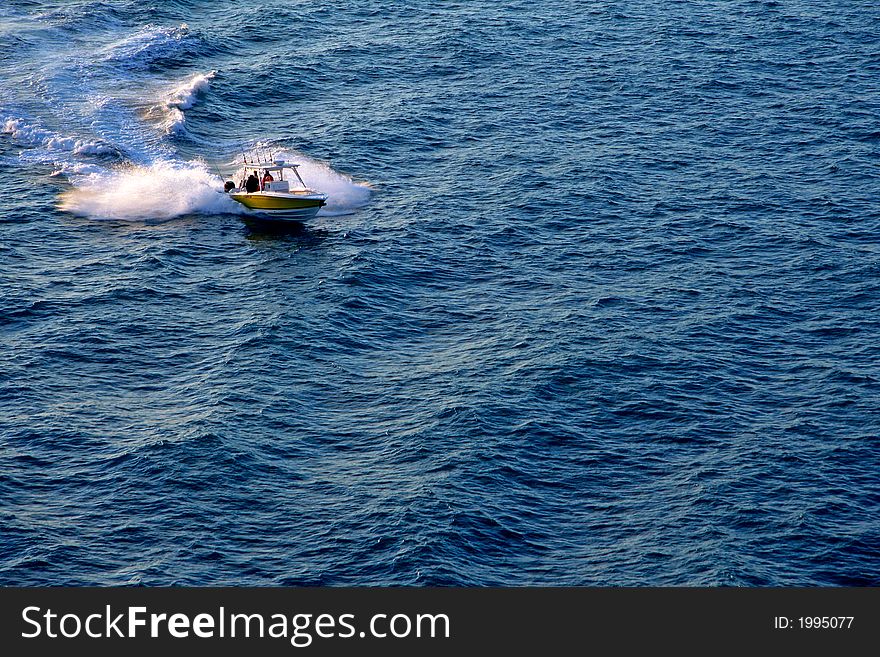 Powerful motor boat cutting though waves