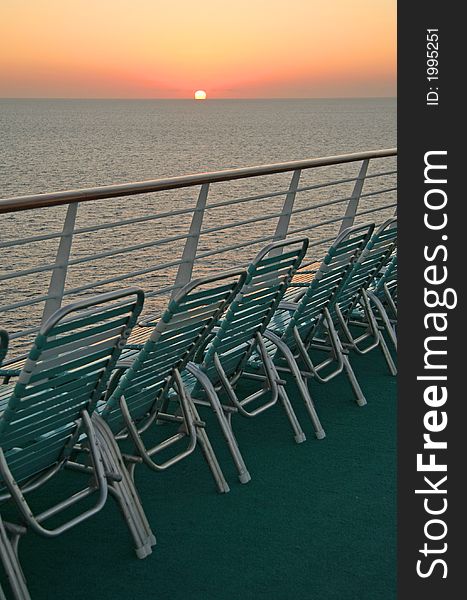 Row of chairs on a deck of a cruise ship. Row of chairs on a deck of a cruise ship