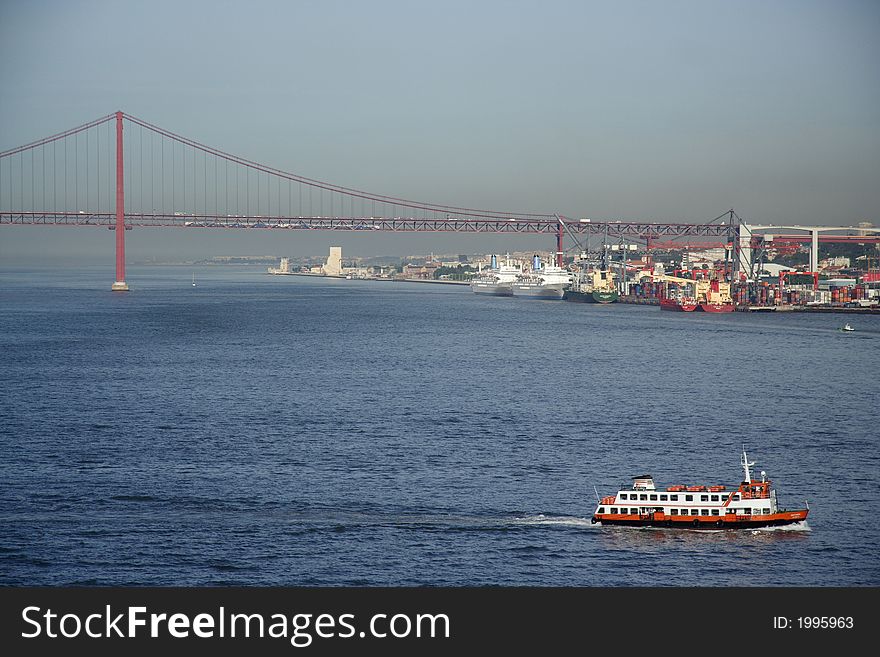 Bay with ferry an a large bridge in the background. Bay with ferry an a large bridge in the background