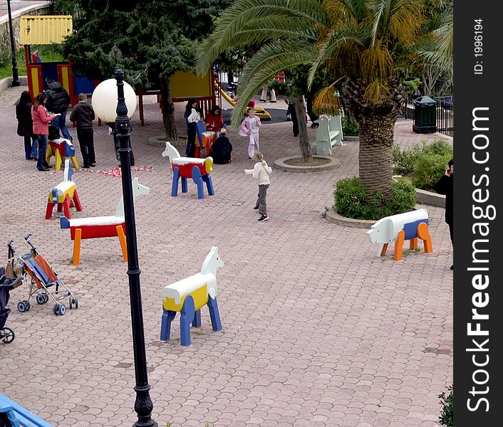 Children play in park on a game place