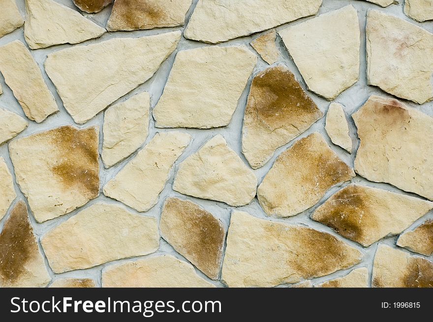 A stone wall with patterns. A stone wall with patterns