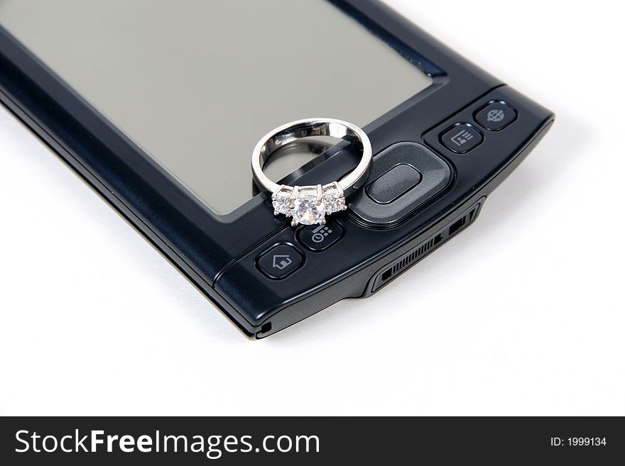 PDA with wedding ring, isolated on white background. PDA with wedding ring, isolated on white background