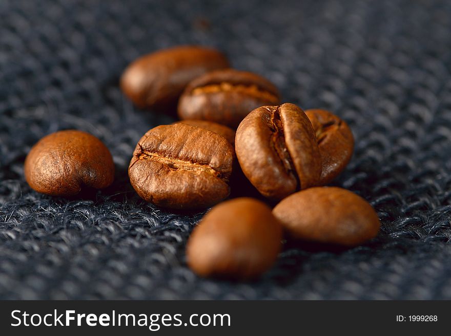 Coffee beans on blue jute