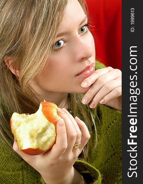Pretty girl is holding a juicy apple in  palm. Pretty girl is holding a juicy apple in  palm