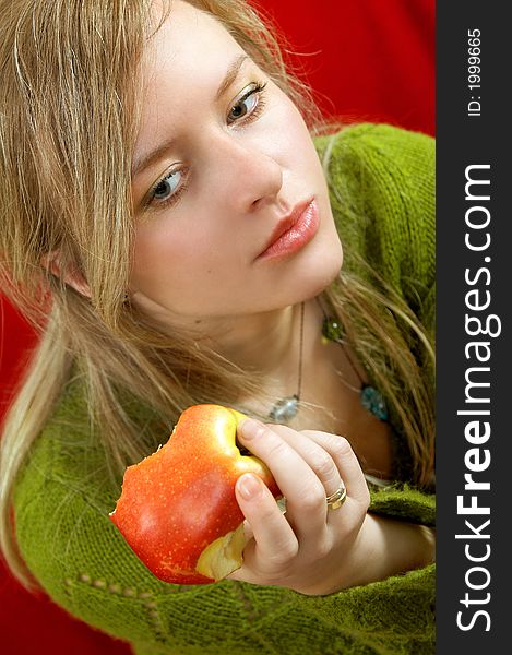 Pretty girl is holding a juicy apple in palm. Pretty girl is holding a juicy apple in palm