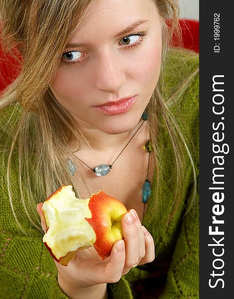 Pretty girl is holding a juicy apple in  palm. Pretty girl is holding a juicy apple in  palm