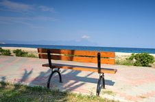 Wooden Bench On The Promenade At The Seafront Royalty Free Stock Photo