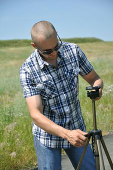 Man And Tripod Stock Image Man And Tripod Stock Image