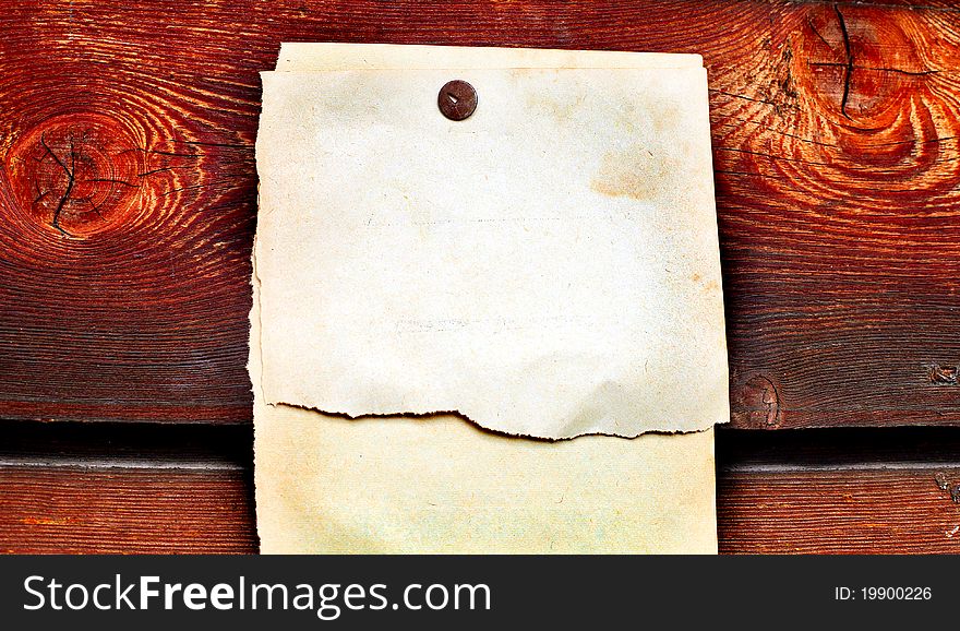 Blank paper hanging on the wooden background. Blank paper hanging on the wooden background