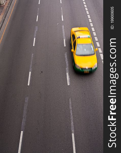 Yellow Car Running On The Road