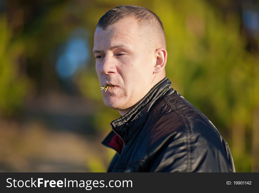 Portrait of young man eating salad, outdoors. Portrait of young man eating salad, outdoors