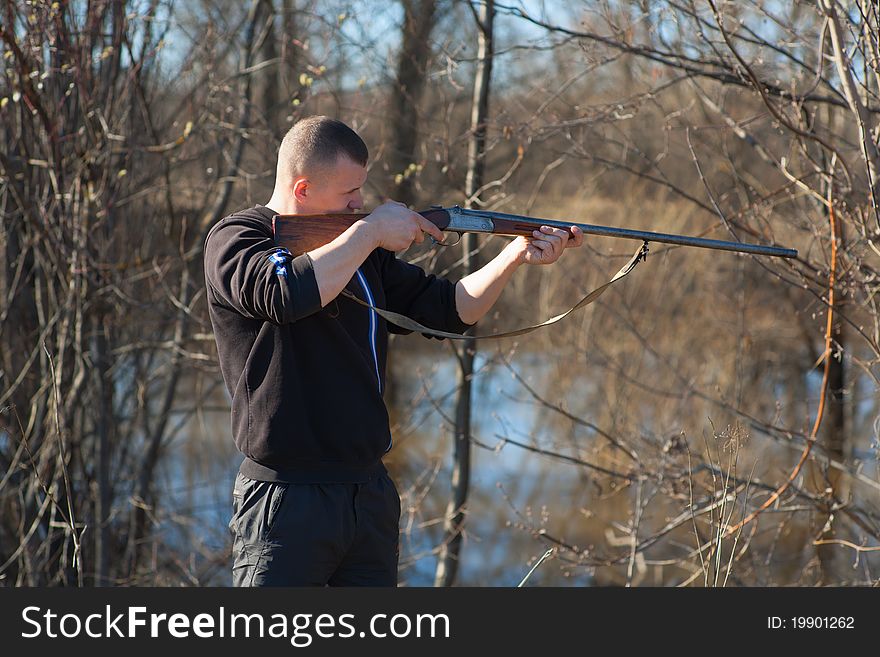 Male hunter aiming the hunt during a hunting party