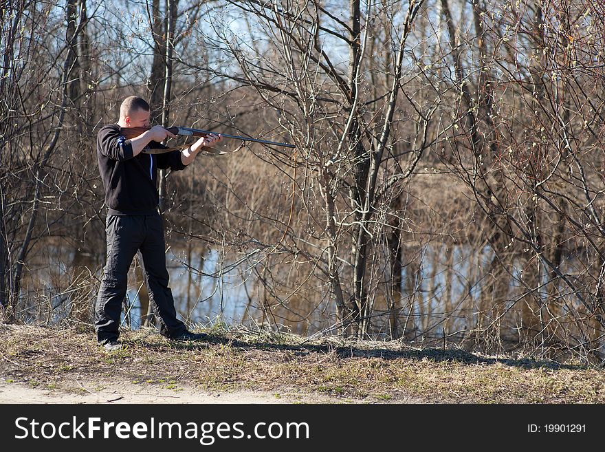 Male hunter aiming the hunt during a hunting party