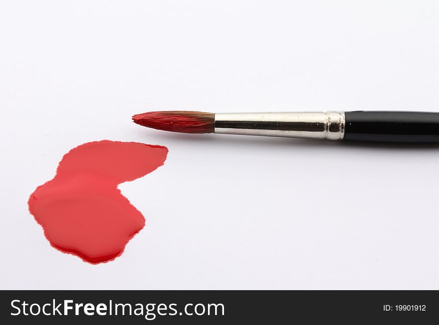 Brush painting white paper with red ink. Brush painting white paper with red ink.