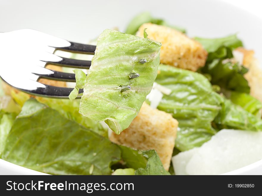 A fresh green salad with croutons and cheese
